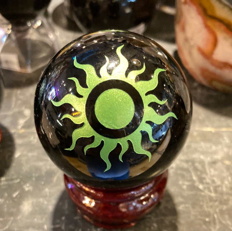 Black obsidian sphere with sun